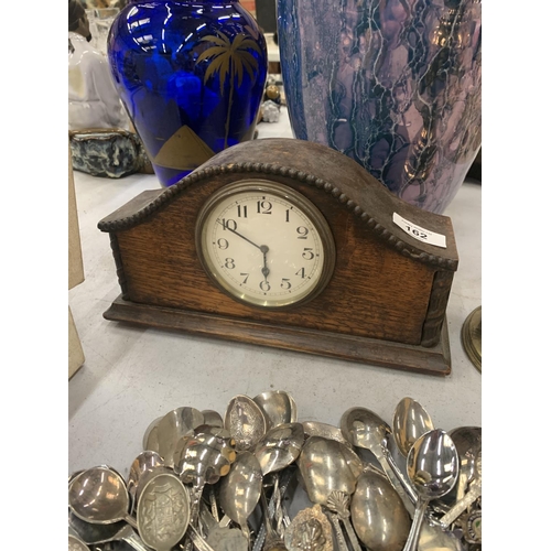 162 - A VINTAGE MAHOGANY MANTLE CLOCK WITH WIND UP MECHANISM