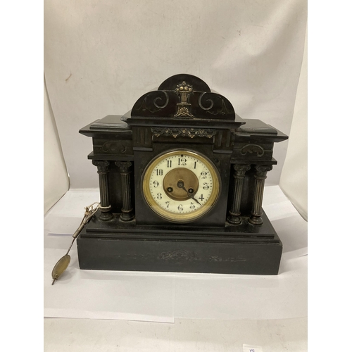 12 - A VICTORIAN SLATE CHIMING MANTLE CLOCK WITH PENDULUM AND KEY