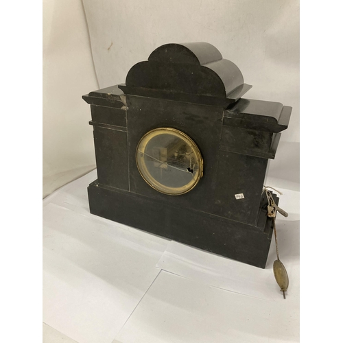 12 - A VICTORIAN SLATE CHIMING MANTLE CLOCK WITH PENDULUM AND KEY