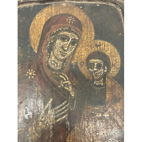 21 - A 19TH CENTURY HAND PAINTED ICON OF THE MADONNA AND CHILD