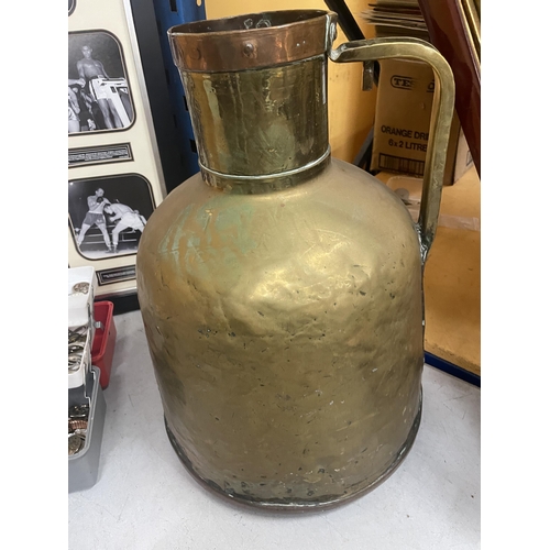 45 - A LARGE VINTAGE BRASS VESSEL WITH COPPER BAND TOP