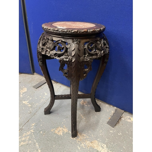 62 - AN ANTIQUE CHINESE CARVED HARDWOOD JARDINIERE STAND WITH MARBLE INSET TOP