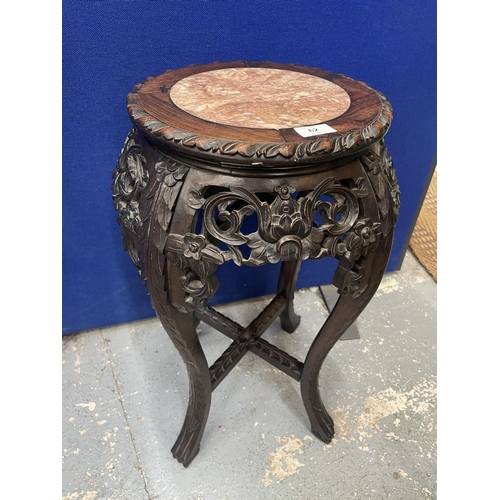 62 - AN ANTIQUE CHINESE CARVED HARDWOOD JARDINIERE STAND WITH MARBLE INSET TOP