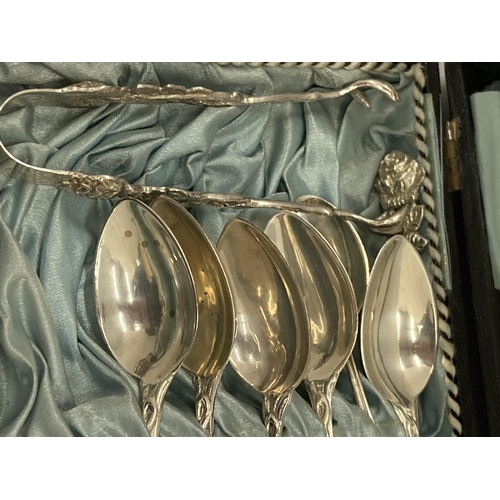 8 - A CASED SET OF 800 GRADE CONTINENTAL SILVER TEASPOONS WITH MATCHING TONGS AND STICKS WITH FLORAL DES... 