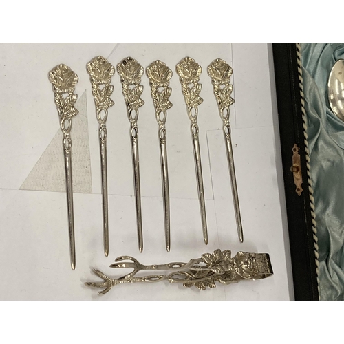 8 - A CASED SET OF 800 GRADE CONTINENTAL SILVER TEASPOONS WITH MATCHING TONGS AND STICKS WITH FLORAL DES... 