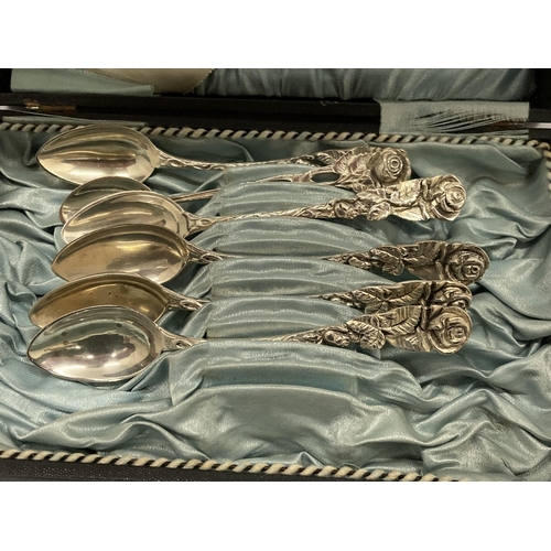 8 - A CASED SET OF 800 GRADE CONTINENTAL SILVER TEASPOONS WITH MATCHING TONGS AND STICKS WITH FLORAL DES... 