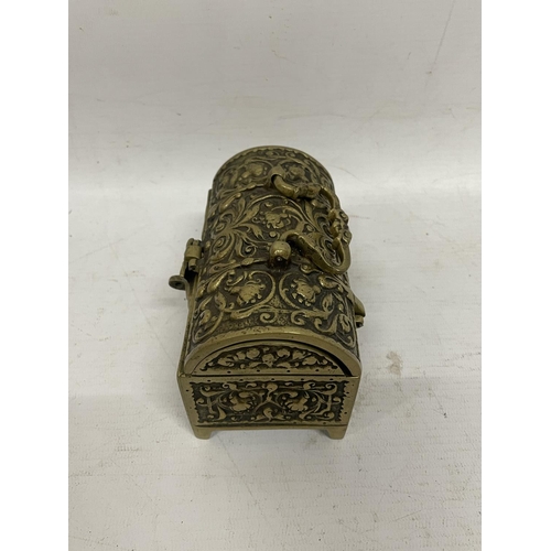 84 - AN ORNATE BRASS CHEST JEWELLERY BOX