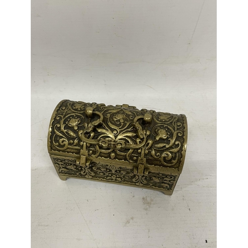 84 - AN ORNATE BRASS CHEST JEWELLERY BOX