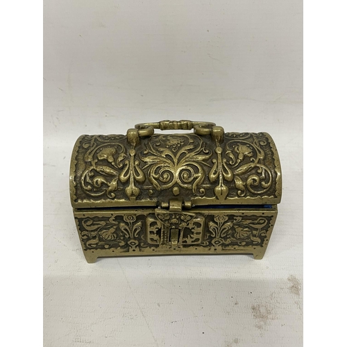 84 - AN ORNATE BRASS CHEST JEWELLERY BOX