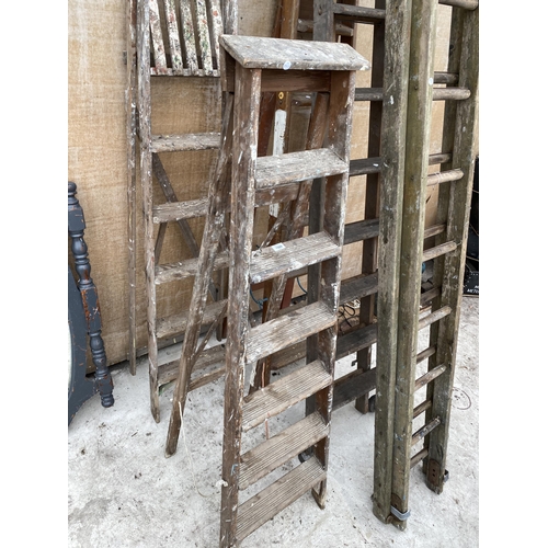 1589 - TWO VINTAGE WOODEN STEP LADDERS TO INCLUDE A SIX RUNG AND A FIVE RUNG