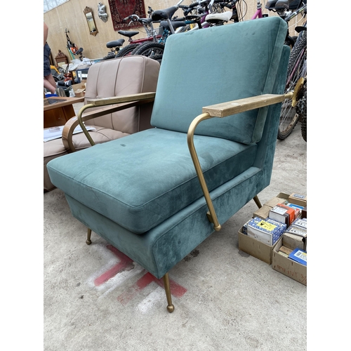 2779 - A KARE DESIGN FIRESIDE CHAIR, GREEN UPHOLSTERED WITH METALWARE ARMS AND LEGS