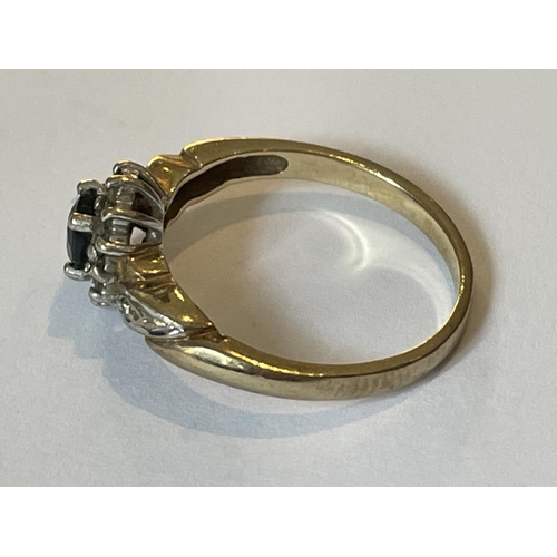 595 - A 9 CARAT GOLD RING WITH A CENTRE SAPPHIRE SURROUNDED BY DIAMONDS SIZE O