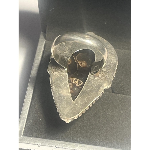 618 - A SILVER RING WITH A FOSSIL STONE IN A PRESENTATION BOX