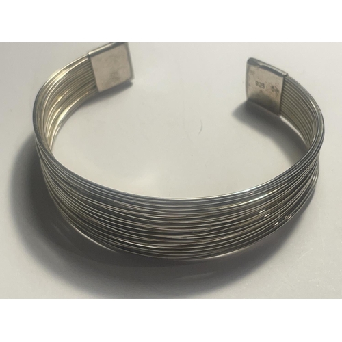 627 - TWO SILVER BANGLES