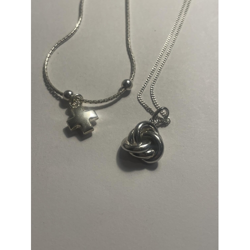 629 - FOUR SILVER NECKLACES WITH PENDANTS