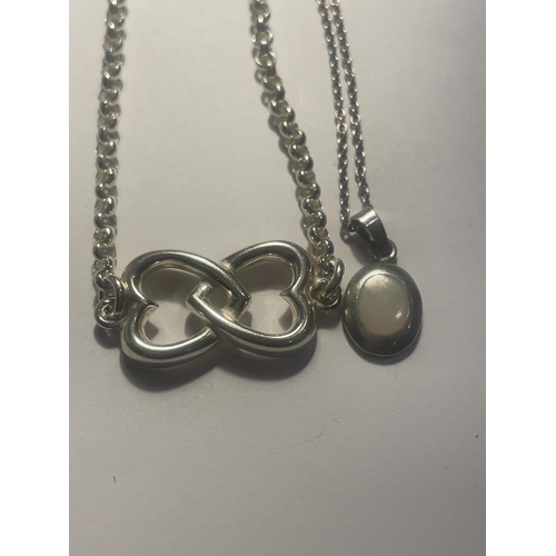 629 - FOUR SILVER NECKLACES WITH PENDANTS