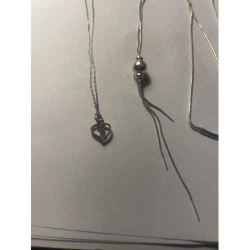 642 - FOUR SILVER NECKLACES WITH PENDANTS