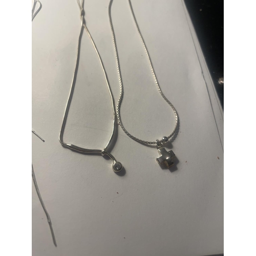 642 - FOUR SILVER NECKLACES WITH PENDANTS