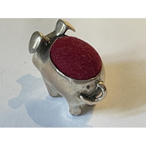 90 - A SILVER PIG PIN CUSHION