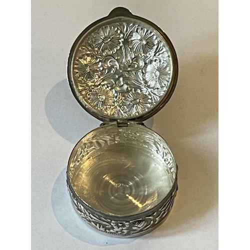 92 - A SILVER CIRCULAR PILL BOX WITH FLORAL DECORATION