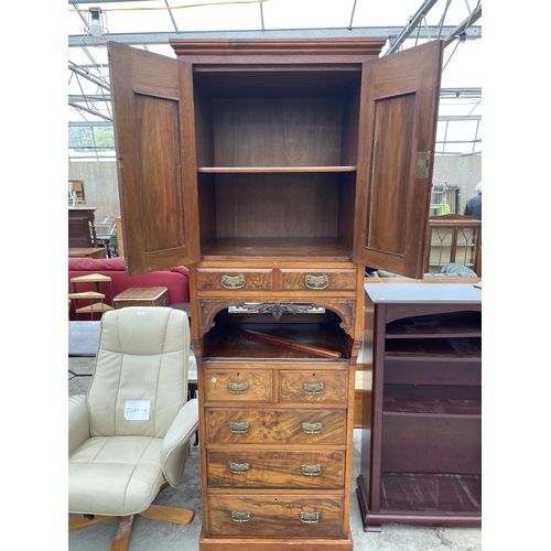 2786 - AN EARLY 20TH CENTURY WALNUT AND MAHOGANY CABINET WITH TWO UPPER DOORS AND DRAWERS AND TWO SHORT AND... 