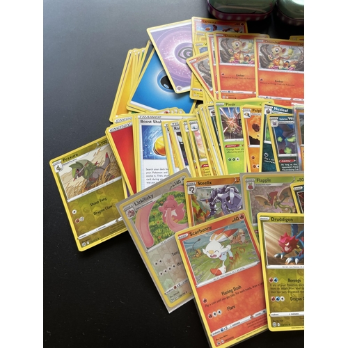 101 - TWO TINS OF ASSORTED POKEMON CARDS, HOLOS ETC