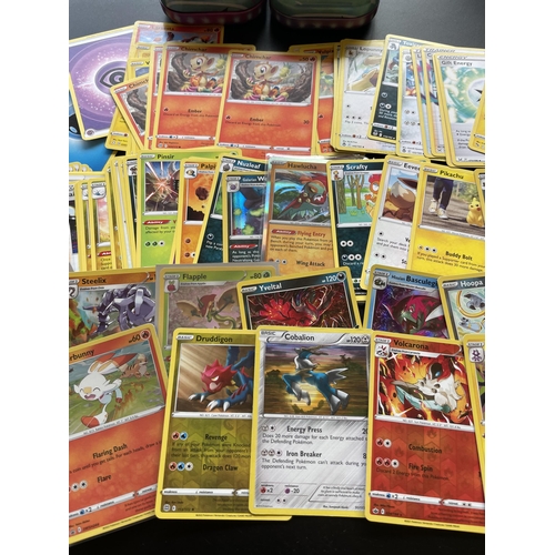 101 - TWO TINS OF ASSORTED POKEMON CARDS, HOLOS ETC