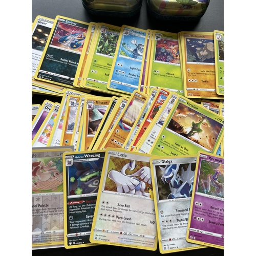 104 - TWO TINS OF ASSORTED POKEMON CARDS, HOLOS ETC