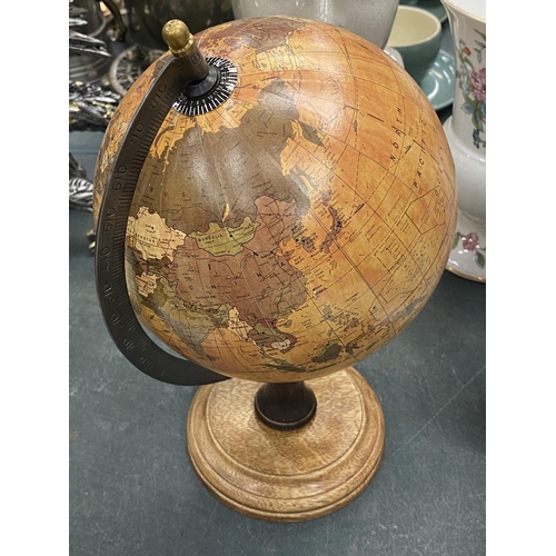 123 - A WORLD GLOBE ON A WOODEN BASE, HEIGHT APPROX 27CM