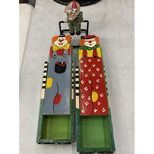 139 - TWO WOODEN PENCIL BOXES IN THE SHAPE OF CLOWNS PLUS AN ACROBATIC CLOWN DESK TOY