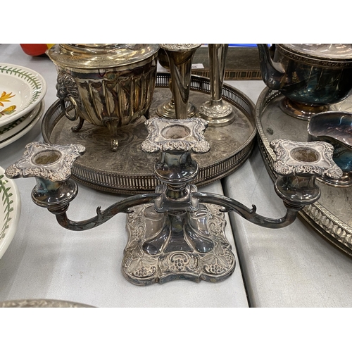 144 - A LARGE QUANTITY OF SILVER PLATED ITEMS TO INCLUDE GALLERIED TRAYS, A ROSE BOWL, TEAPOTS, VASES, CAN... 