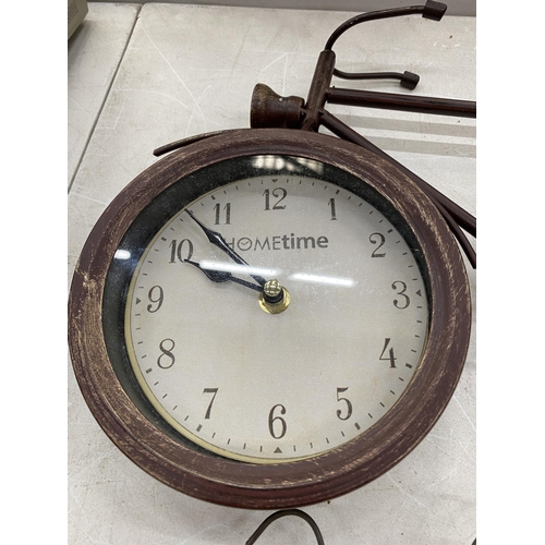 173 - A WROUGHT IRON CLOCK IN THE SHAPE OF A BIKE AND A TIN PLATE COFFEE SIGN