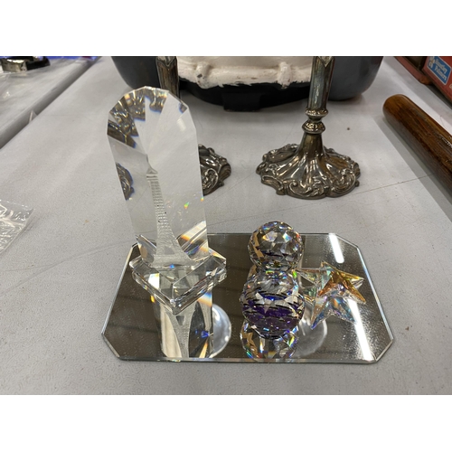 183 - A QUANTITY OF CRYSTAL FIGURES TO INCLUDE OWLS, A STAR, AN APPLE, SPHERES AND A PAPERWEIGHT ON MIRROR... 