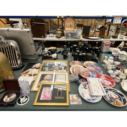 201 - A LARGE COLLECTION OF MARILYN MONROE MEMORABILIA TO INCLUDE A FRAMED FILM CELL AND FRAMED PHOTO WITH... 