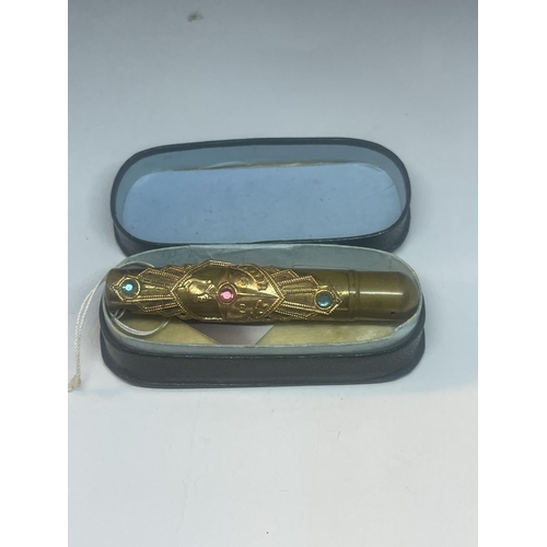 87 - A 1951 DECORATIVE TRAVEL PEN WITH COLOURED STONES WITH A PRESENTATION BOX