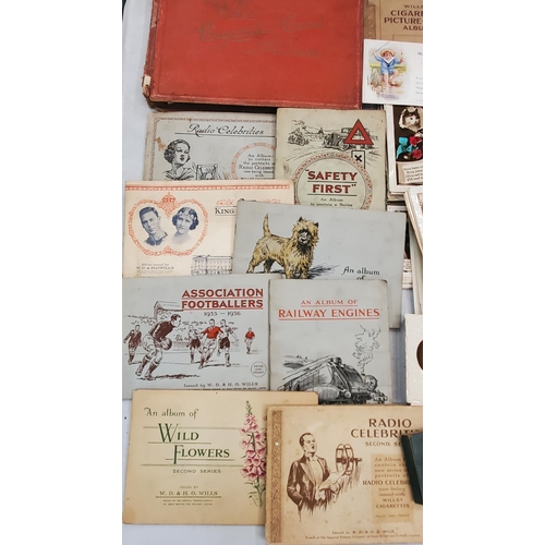 267 - A COLLECTION OF VINTAGE CIGARETTE CARD ALBUMS TOGETHER WITH LOOSE EXAMPLES