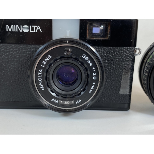 115 - A MINOLTA CAMERA WITH 38MM 1:2.8 46MM LENS AND FURTHER MINOLTA MD ROKKOR 50MM 1:1.7 LENS