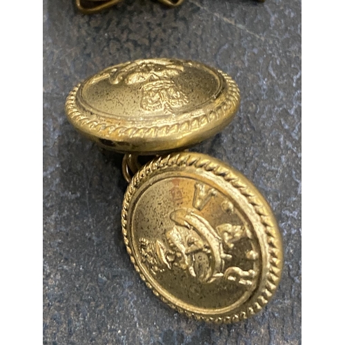 218 - TEN ROYAL NAVY BRASS BUTTONS