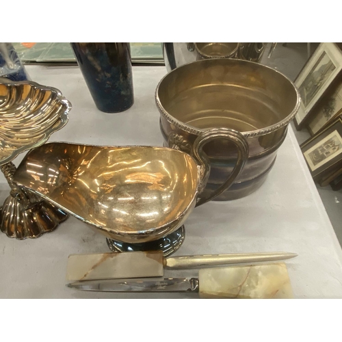 221 - A QUANTITY OF SILVER PLATED ITEMS TO INCLUDE AN ICE BUCKET, COCKTAIL SHAKER, A SHELL DISH ON A FISH ... 