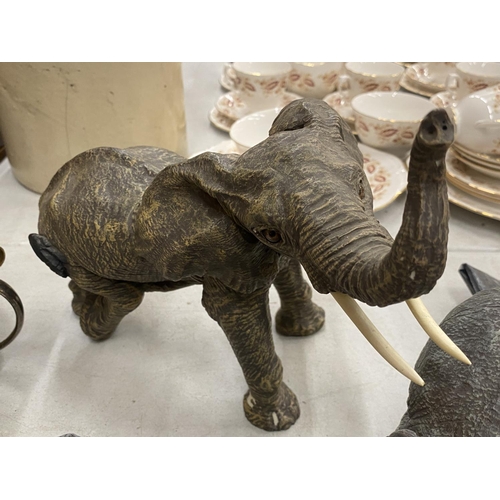 293 - A COLLECTION OF RESIN ELEPHANTS - 8 IN TOTAL TO INCLUDE TUSKERS, RUFF & TUMBLE, HERD, ETC.,