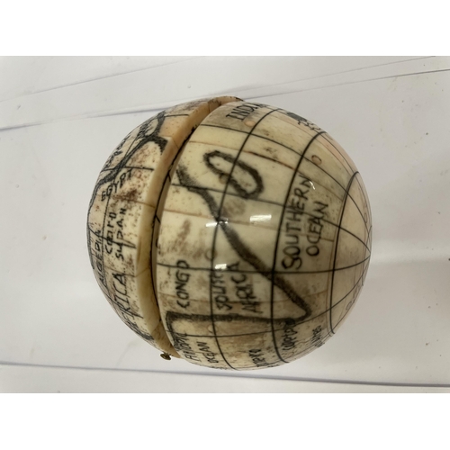 14 - A VINTAGE BONE GLOBE COMPASS