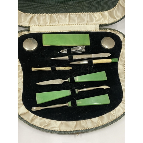 33 - AN ART DECO CASED MANICURE SET WITH JADE STYLE HANDLES