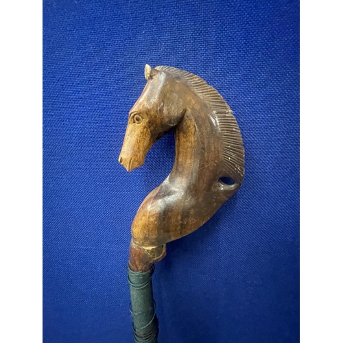 38 - A VINTAGE WALKING/THUMB STICK WITH HORSE HEAD DESIGN