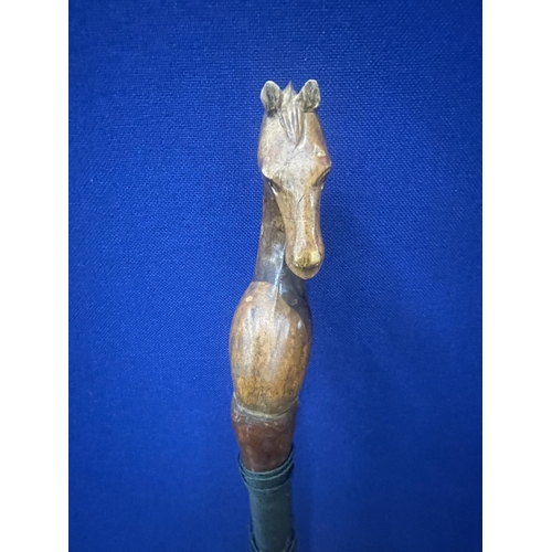 38 - A VINTAGE WALKING/THUMB STICK WITH HORSE HEAD DESIGN