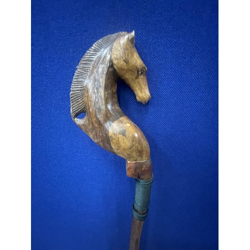 38 - A VINTAGE WALKING/THUMB STICK WITH HORSE HEAD DESIGN