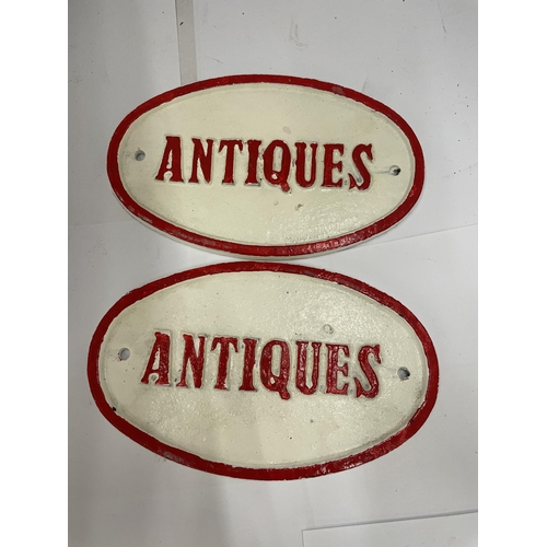 41 - A PAIR OF CAST ANTIQUES OVAL SIGNS