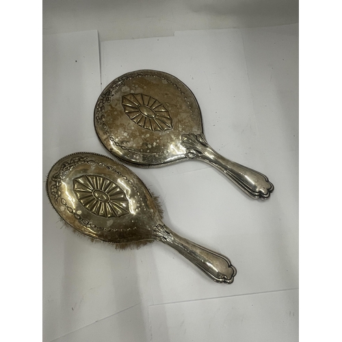 44 - A PAIR OF EDWARDIAN SILVER DRESSING TABLE ITEMS - MIRROR AND BRUSH