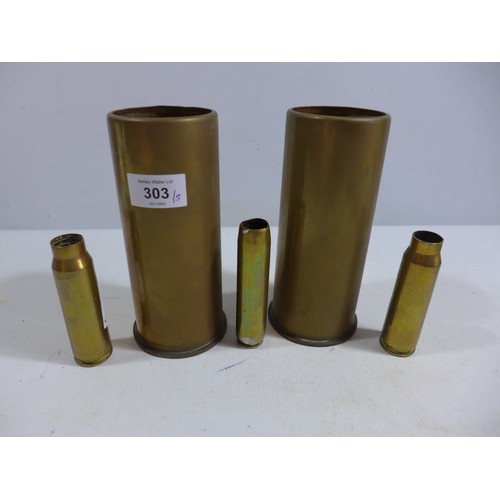 303 - FIVE ASSORTED BRASS SHELL CASES, HEIGHTS FROM 10.5 TO 18CM