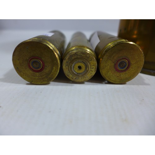 303 - FIVE ASSORTED BRASS SHELL CASES, HEIGHTS FROM 10.5 TO 18CM