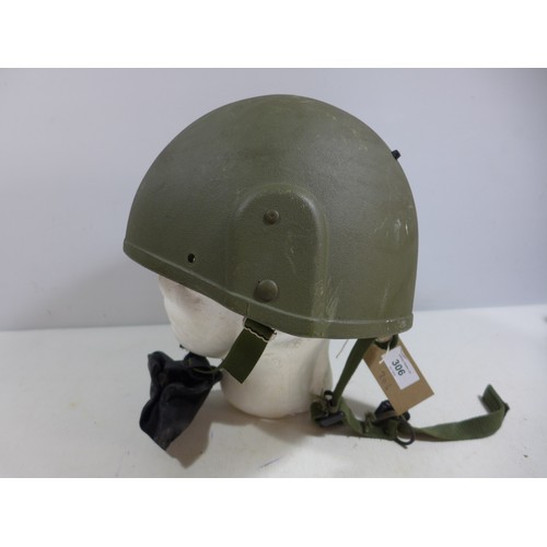 306 - A GREEN NATO HELMET AND LINER DATED 1996